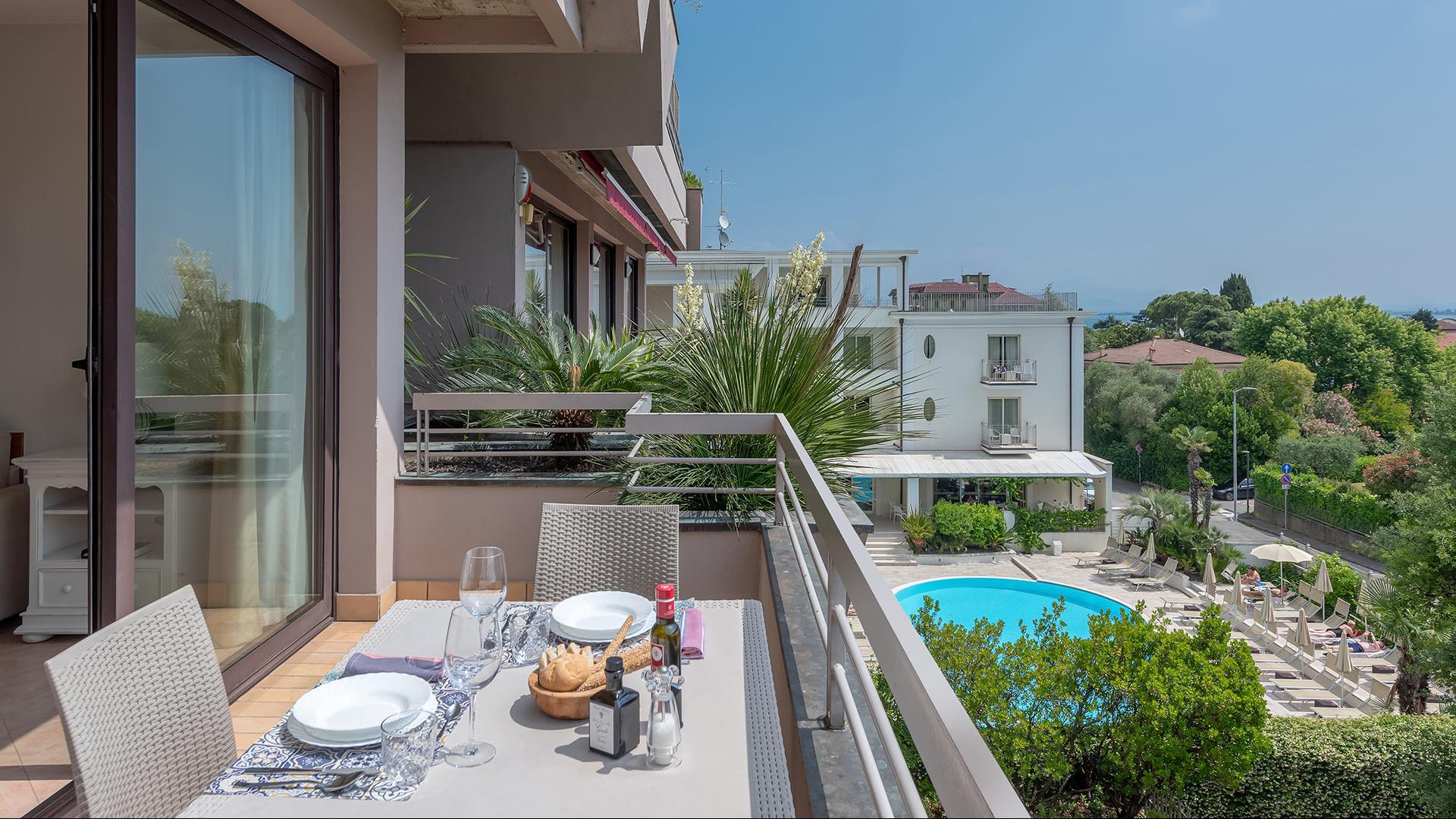 Elegant terrace overlooking pool, ideal for relaxing summer dinners.